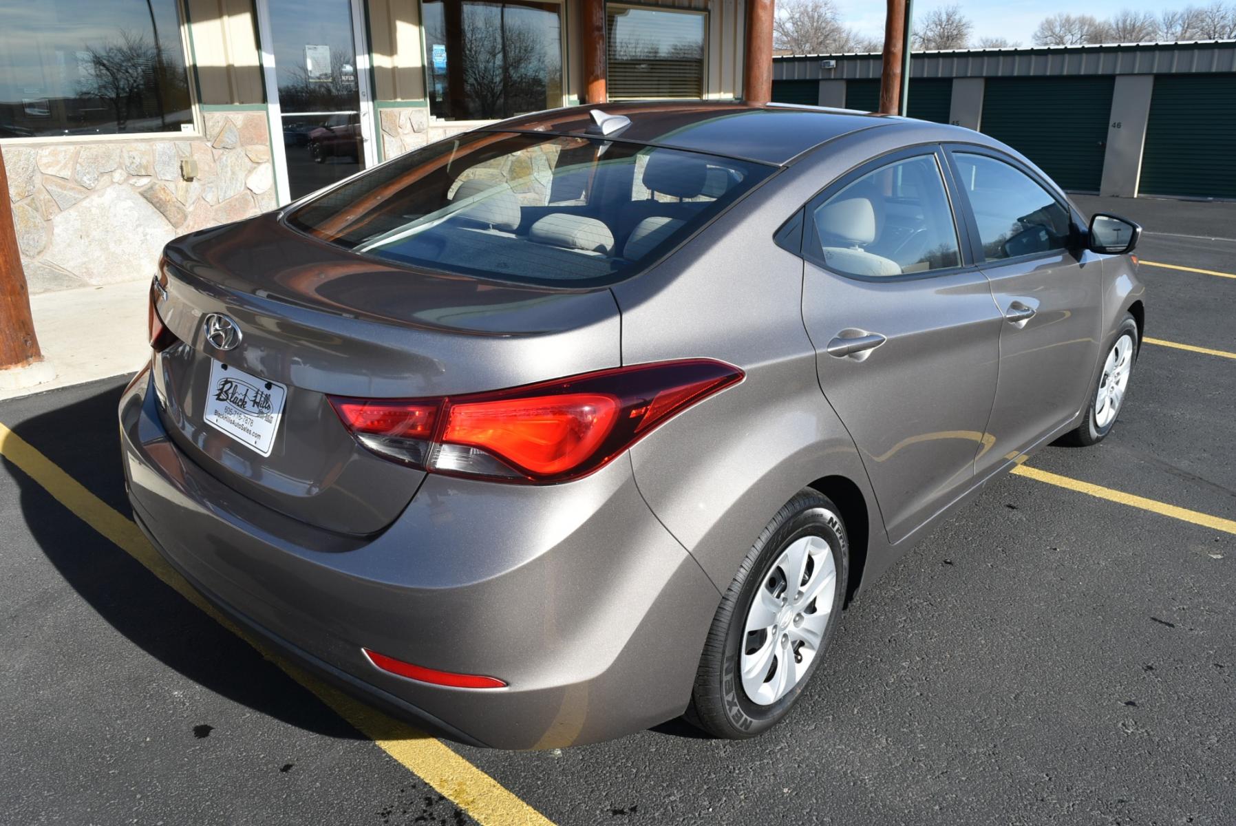 2016 Bronze Hyundai Elantra SE (5NPDH4AE3GH) with an 1.8L 4 Cyl engine, 6-Speed Automatic transmission, located at 1600 E Hwy 44, Rapid City, SD, 57703, (605) 716-7878, 44.070232, -103.171410 - Photo #7